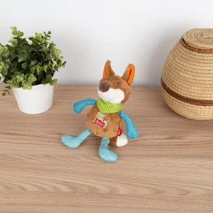 Deklica se igra z glasbeno igračo Sigikid v obliki lisice.